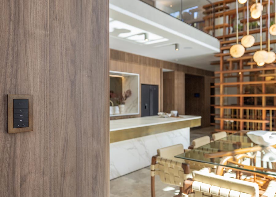 Wall-mounted control panel in stylish modern dining area